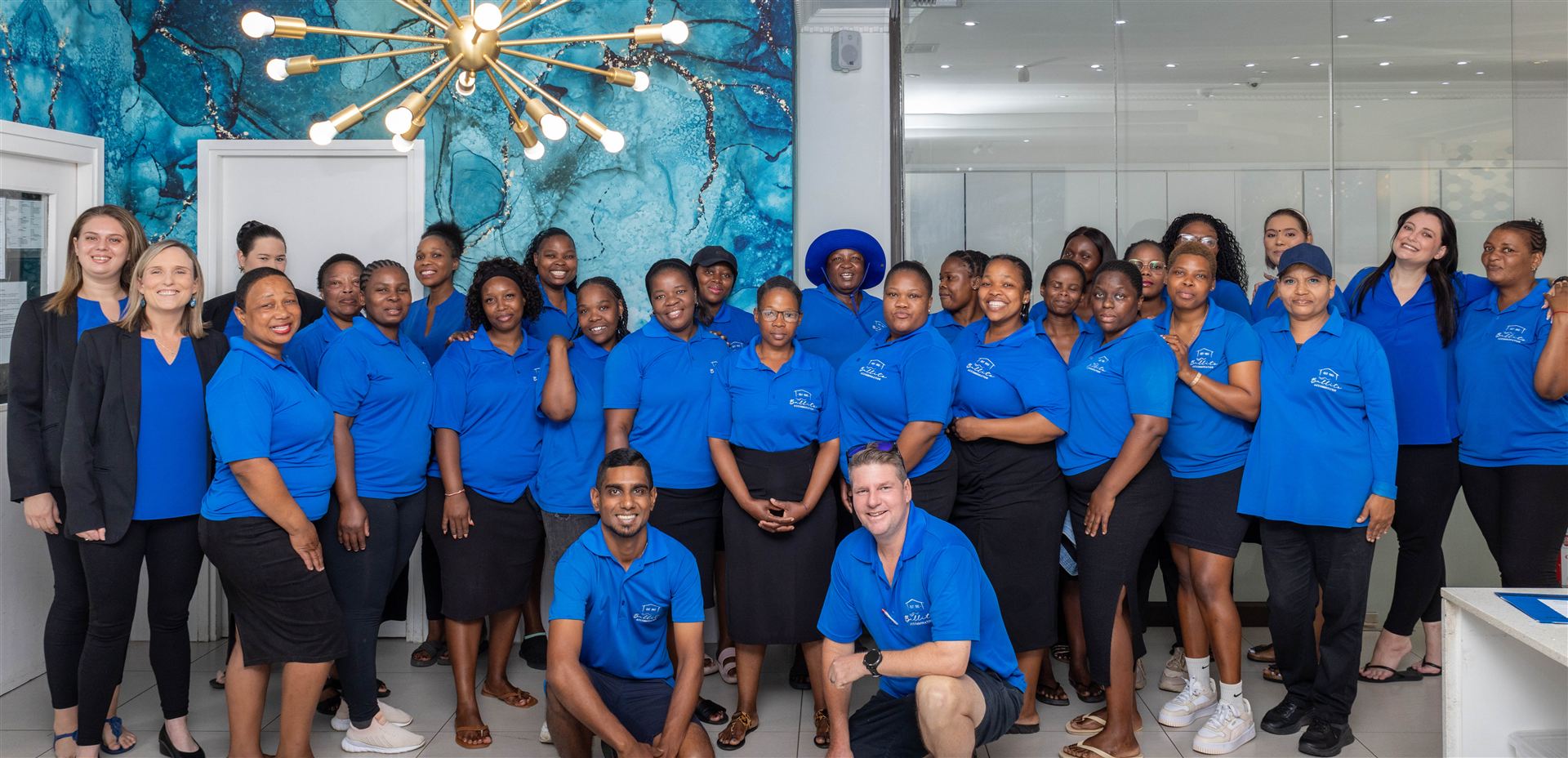 The Ballito Accommodation team in blue shirts at the Sandra Road office